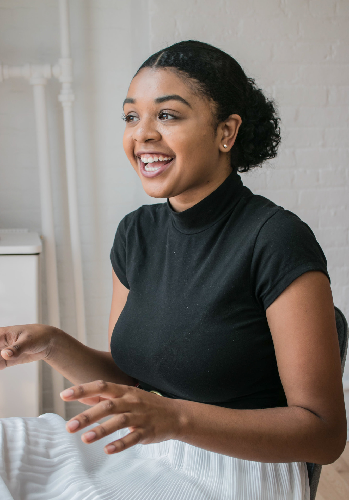 Product manager smiling during a team conversation